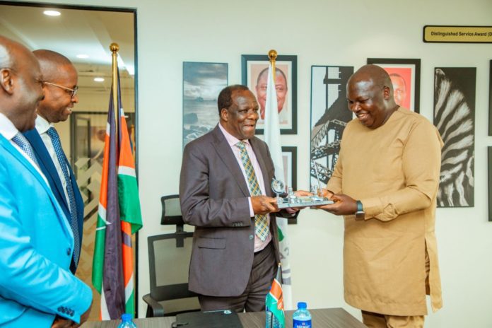 ACCOSCA CEO George Ombado accompanied by KUSCCO Interim Board Chair David Mategwa and Ag CEO Anorld Munene during their meeting with CS Wycliffe Oparanya. They briefed him on the upcomming SACCA congress.